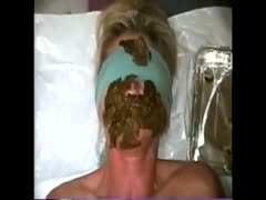 A mature whore had filthy excrement all over her face.